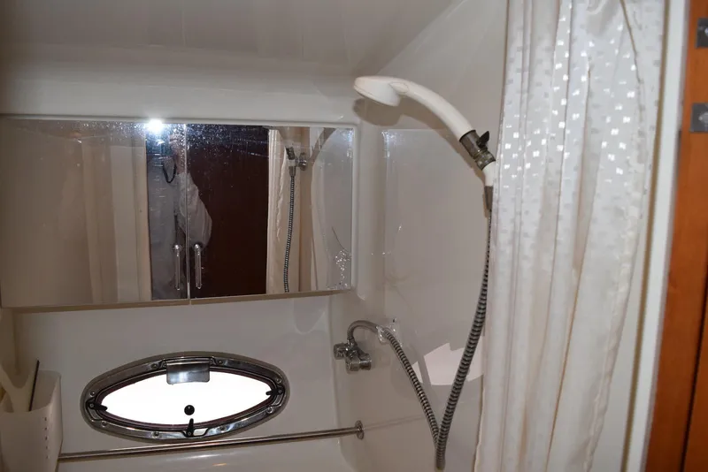 Slide: The Image of Bathroom interior of 2001 Carver 444 Cockpit Motor Yacht with shower and mirror. - 26