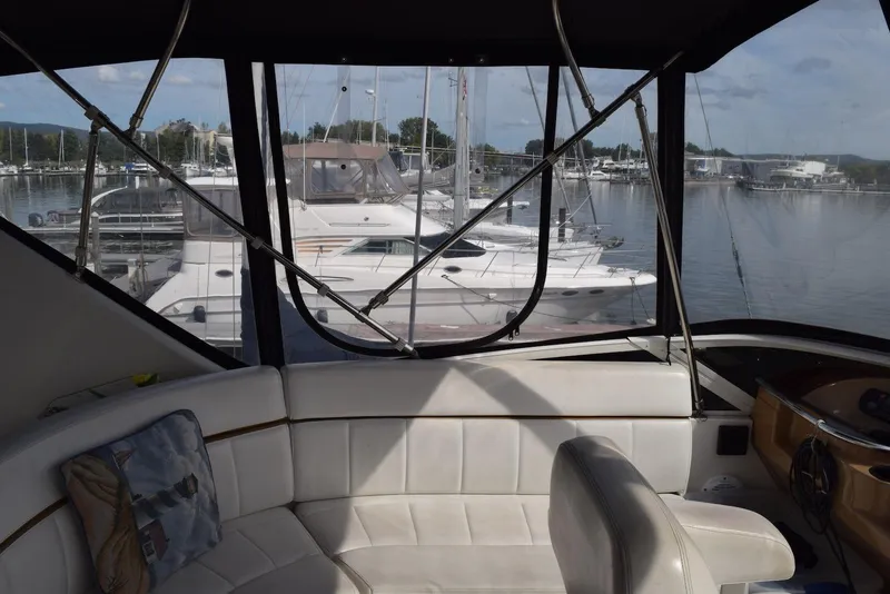 Slide: The Image of Interior view of 2001 Carver 444 Cockpit Motor Yacht in marina setting. - 5