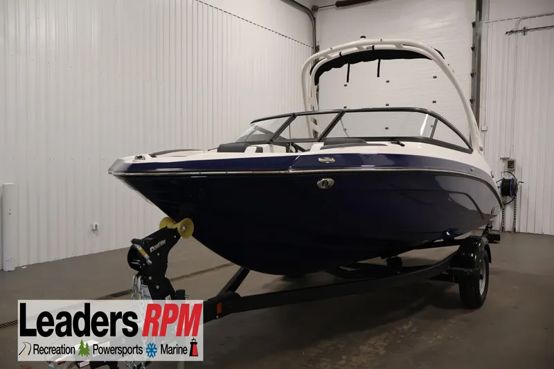 The Image of 2026 Yamaha Boats 195S in showroom, sleek design, on trailer, Leaders RPM logo visible. - 0
