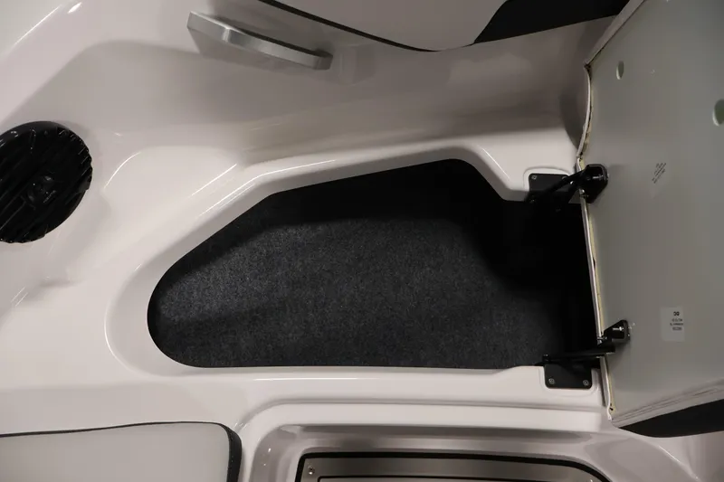 Slide: The Image of Interior storage compartment of 2026 Yamaha Boats 195S, featuring sleek design and ample space. - 14