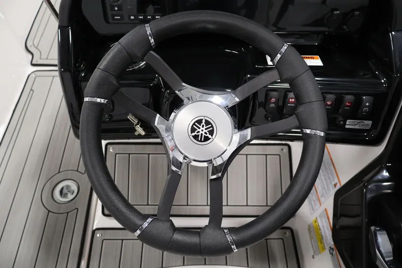 Slide: The Image of Steering wheel of 2026 Yamaha Boats 195S, featuring sleek design and modern controls. - 19