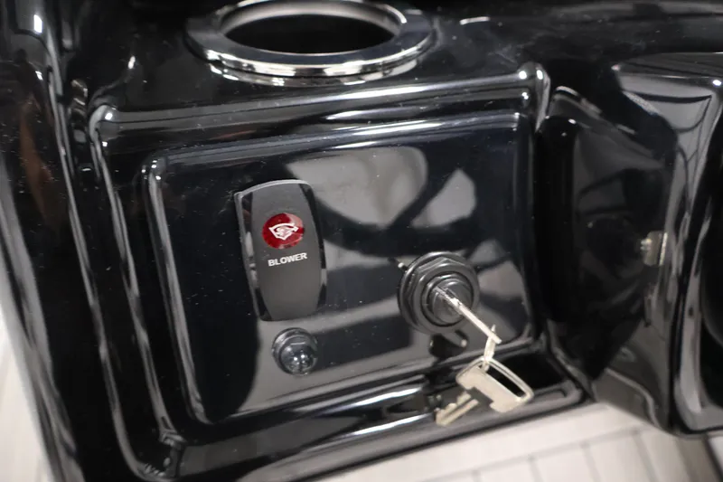 Slide: The Image of Control panel of 2026 Yamaha Boats 195S with blower switch and ignition key. - 23