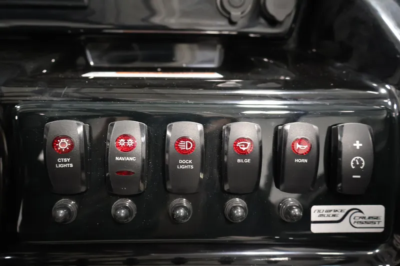 Slide: The Image of Control panel of 2026 Yamaha Boats 195S with labeled switches for lights, bilge, and horn. - 24