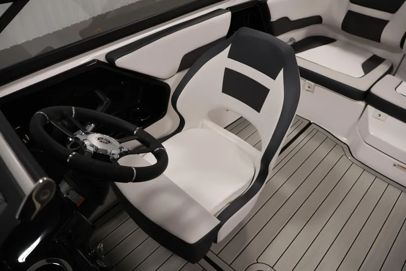 Slide: The Image of 2026 Yamaha Boats 195S interior with sleek steering wheel and modern seating design. - 26