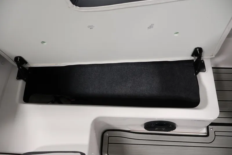 Slide: The Image of Open storage compartment in 2026 Yamaha Boats 195S, showcasing spacious interior design. - 31