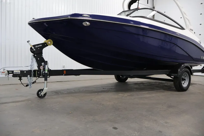 Slide: The Image of 2026 Yamaha Boats 195S on trailer in indoor setting. - 37