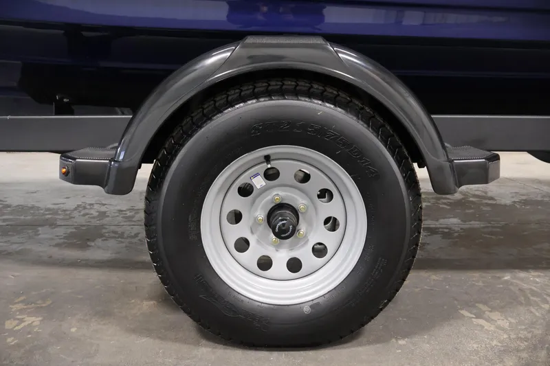 Slide: The Image of 2026 Yamaha Boats 195S trailer wheel and fender, showcasing durable design and construction. - 38