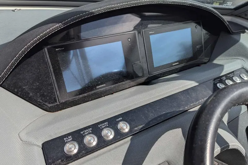 Slide: The Image of Dashboard of a 2020 Cobalt 25SC boat with dual Garmin displays and control buttons. - 8