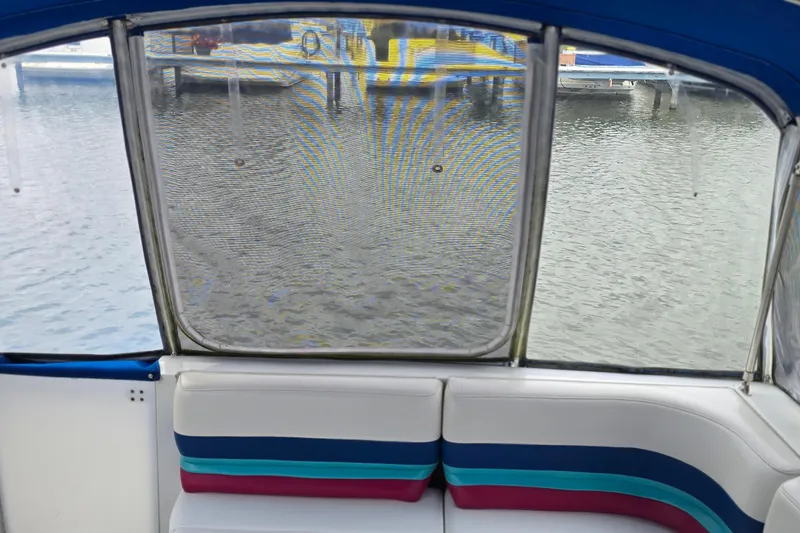Slide: The Image of Interior view of a 1995 Formula 34 Performance Cruiser with colorful seating. - 10