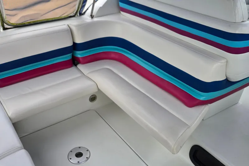 Slide: The Image of 1995 Formula 34 Performance Cruiser interior with colorful striped seating. - 12