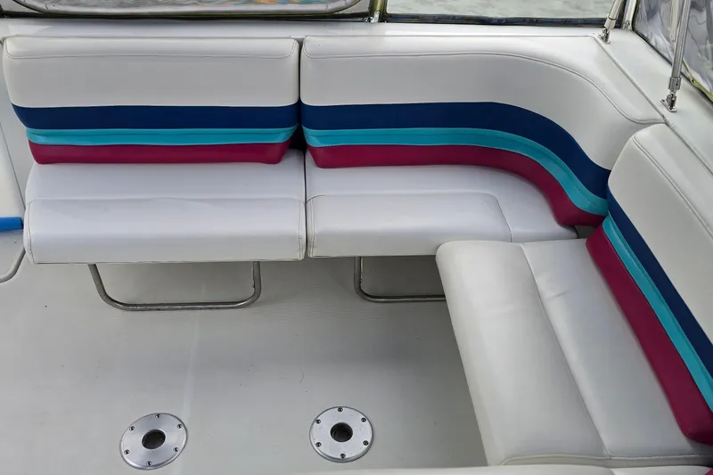Slide: The Image of 1995 Formula 34 Performance Cruiser interior with colorful striped seating. - 13