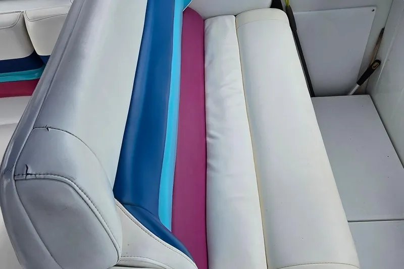 Slide: The Image of Colorful seating on a 1995 Formula 34 Performance Cruiser boat. - 15