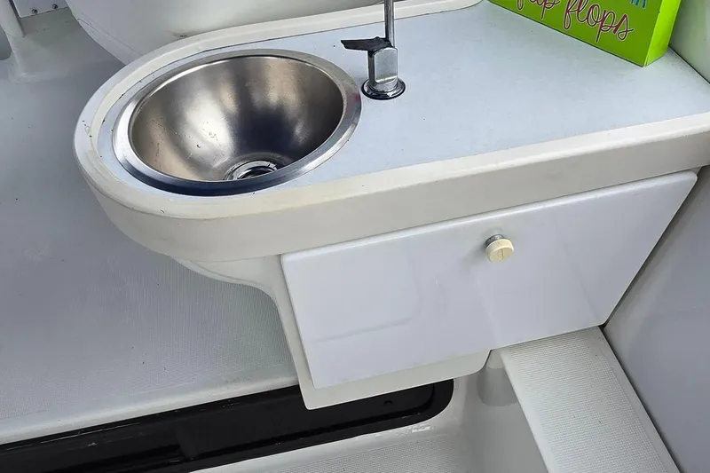 Slide: The Image of 1995 Formula 34 Performance Cruiser sink and countertop detail. - 17