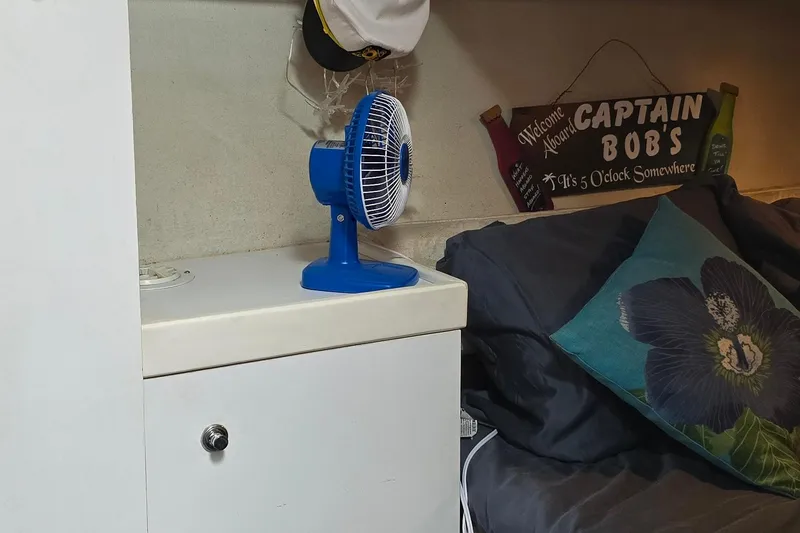 Slide: The Image of Interior of 1995 Formula 34 Performance Cruiser with fan and nautical decor. - 19