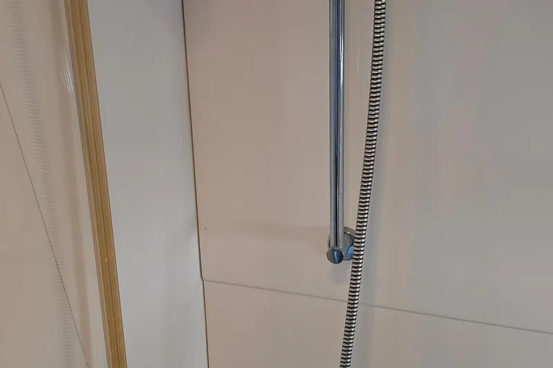 Slide: The Image of Shower area inside 1995 Formula 34 Performance Cruiser yacht, featuring chrome fixtures. - 20