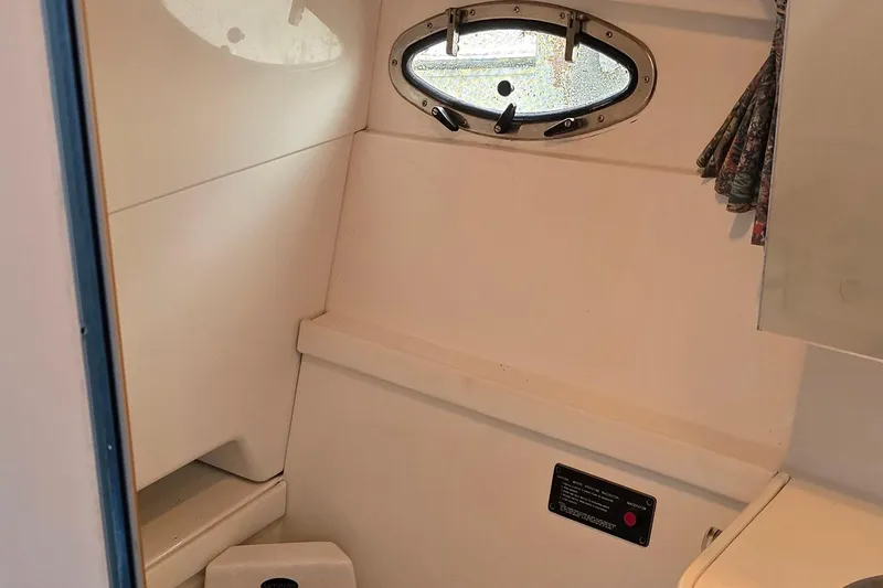 Slide: The Image of Interior of 1995 Formula 34 Performance Cruiser with porthole and compact design. - 21