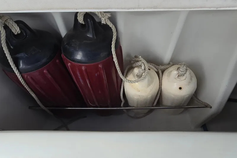 Slide: The Image of Boat fenders stored on a 1995 Formula 34 Performance Cruiser. - 36