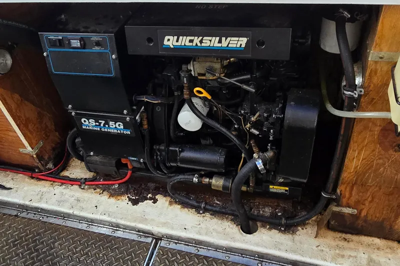 Slide: The Image of Engine compartment of a 1995 Formula 34 Performance Cruiser with Quicksilver marine generator. - 39