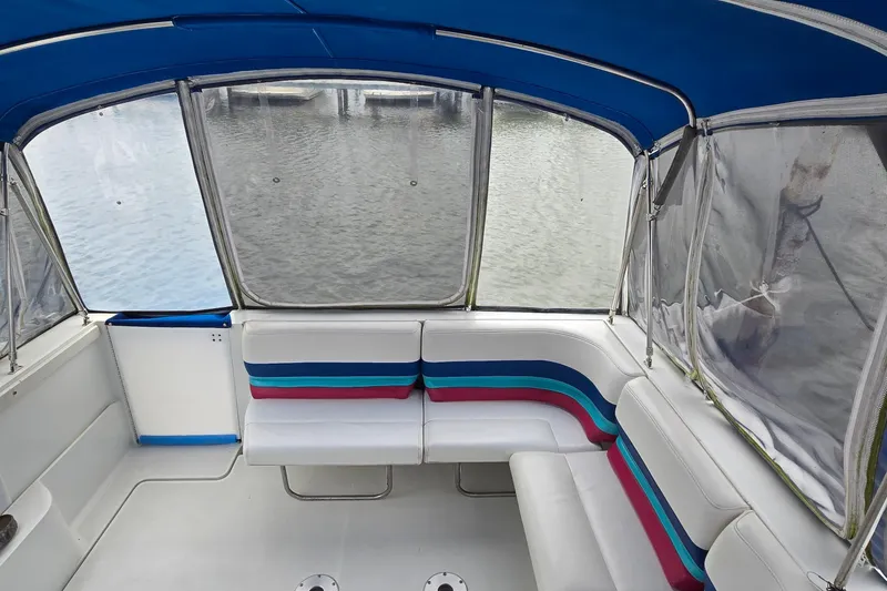 Slide: The Image of 1995 Formula 34 Performance Cruiser interior with colorful seating and water view. - 9