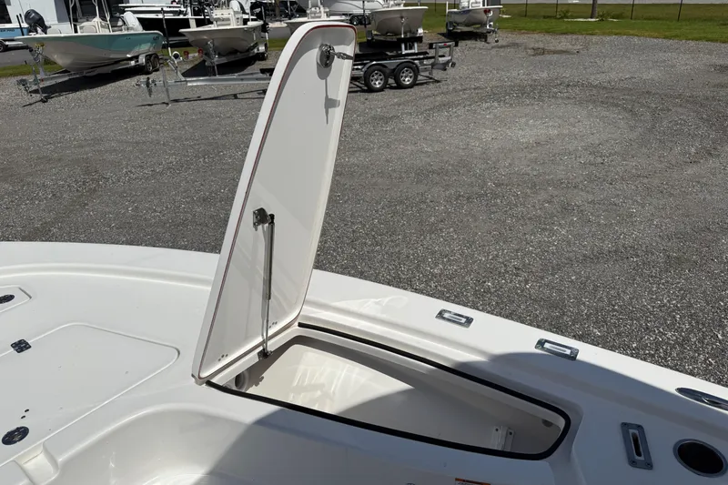 Slide: The Image of 2023 Sea Pro 228 Bay boat with open storage compartment on deck. - 14