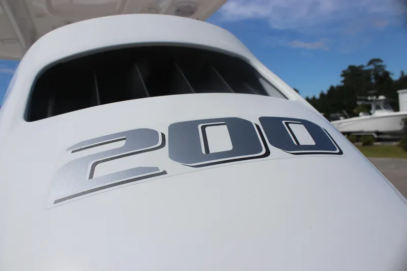 Slide: The Image of Close-up of a 2023 Sea Pro 228 Bay boat engine with "200" decal. - 5