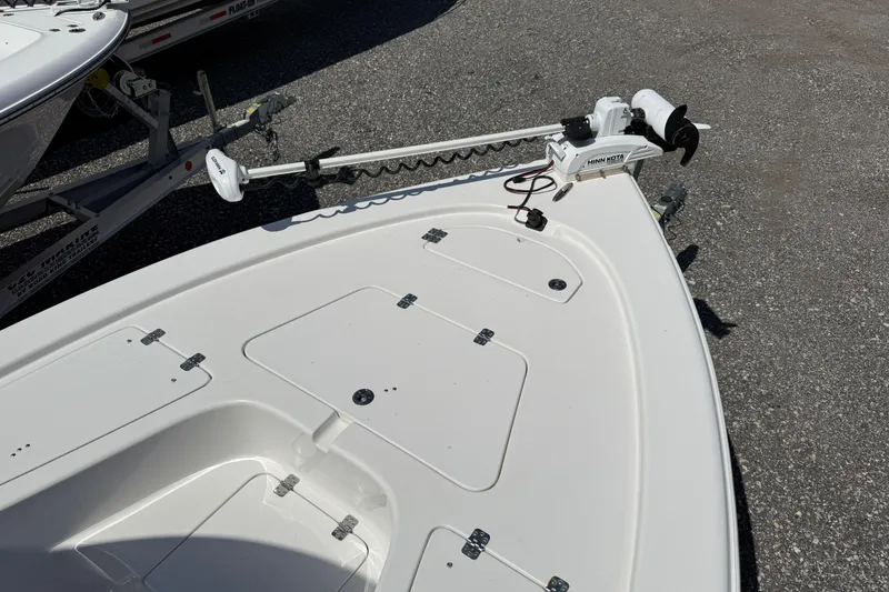 Slide: The Image of 2023 Sea Pro 228 Bay boat bow with trolling motor on trailer. - 6