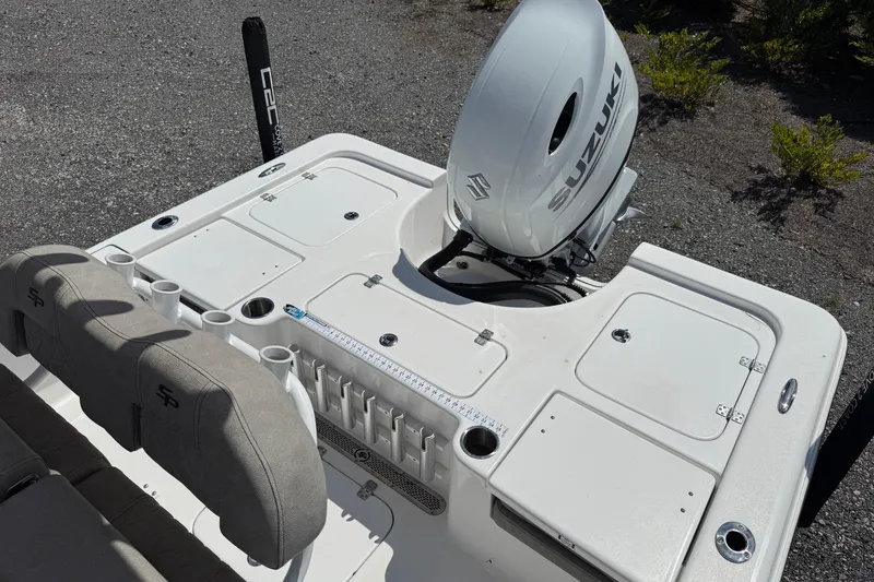 Slide: The Image of 2023 Sea Pro 228 Bay boat with Suzuki outboard motor, featuring spacious deck and seating. - 7