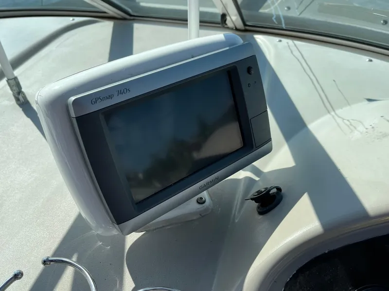 Slide: The Image of GPS device on 2001 Cruisers Yachts 2870 Express dashboard. - 13