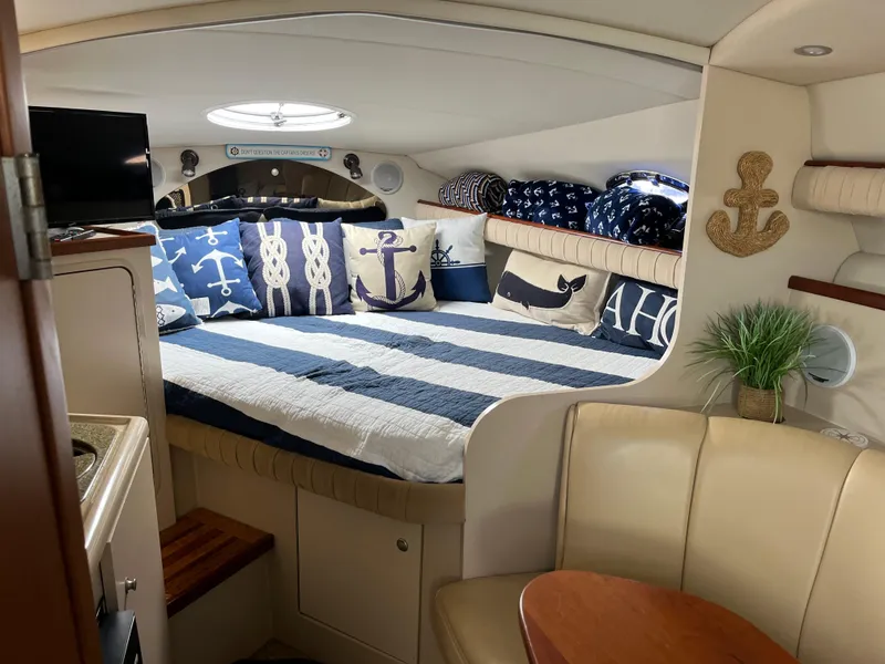 Slide: The Image of Cozy interior of 2001 Cruisers Yachts 2870 Express with nautical-themed decor. - 17