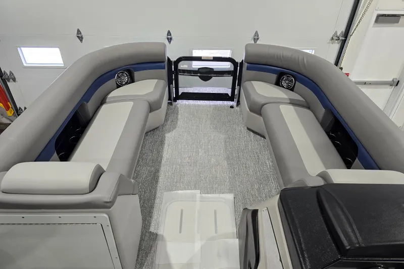 Slide: The Image of 2025 Premier 250 Sunsation RS pontoon boat interior with gray seating and modern design. - 12