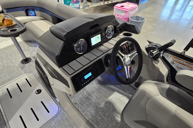 Slide: The Image of 2025 Premier 250 Sunsation RS boat interior with modern dashboard and comfortable seating. - 16