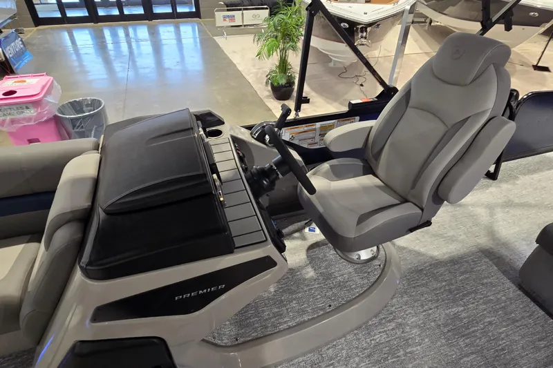 Slide: The Image of 2025 Premier 250 Sunsation RS boat interior with captain's chair and control panel. - 17