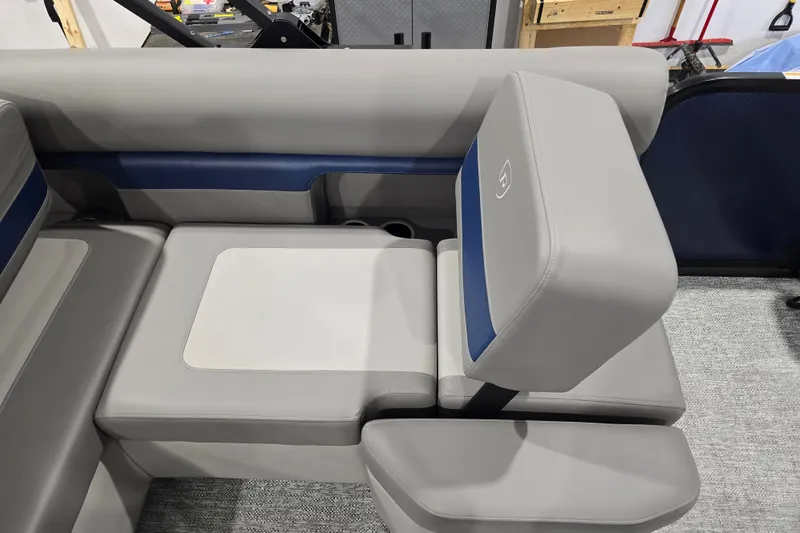 Slide: The Image of 2025 Premier 250 Sunsation RS boat seating with gray and blue upholstery. - 18