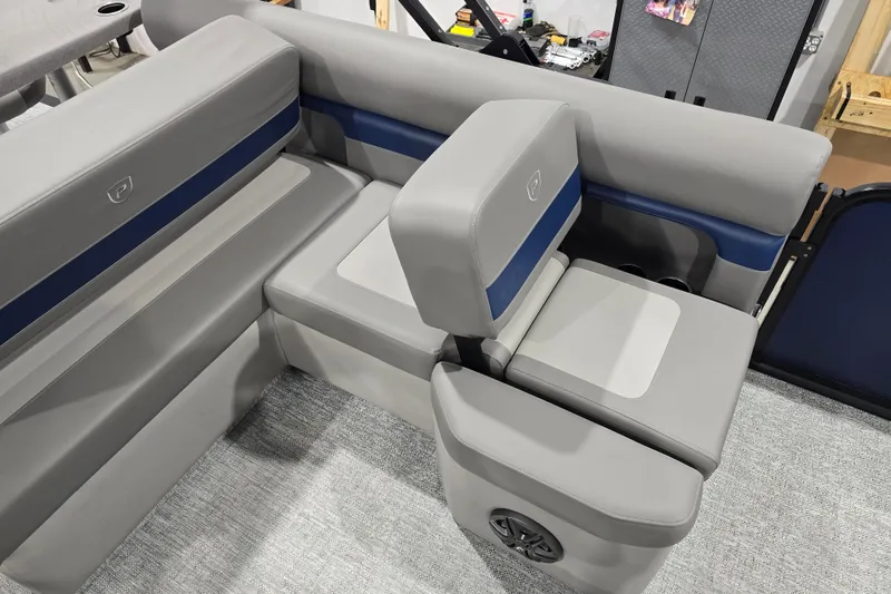 Slide: The Image of 2025 Premier 250 Sunsation RS boat seating, featuring gray and blue cushioned seats. - 19