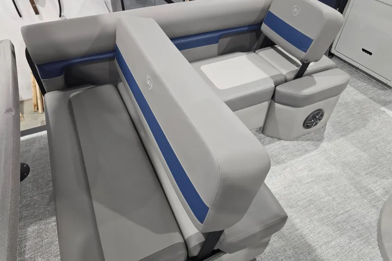 Slide: The Image of 2025 Premier 250 Sunsation RS boat interior with gray and blue seating. - 22
