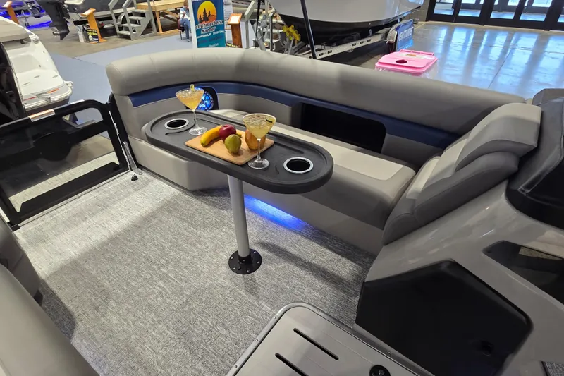Slide: The Image of Interior of 2025 Premier 250 Sunsation RS pontoon boat with seating and refreshments. - 27