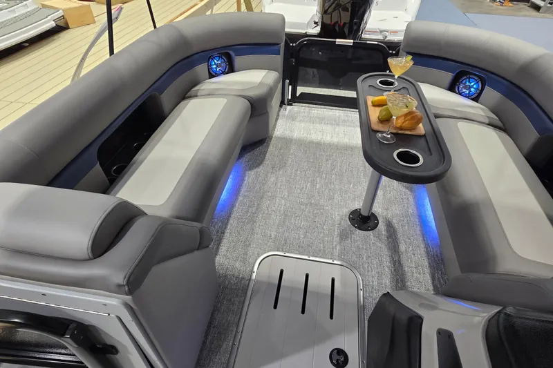 Slide: The Image of Luxurious interior of 2025 Premier 250 Sunsation RS pontoon boat with seating and refreshments. - 28