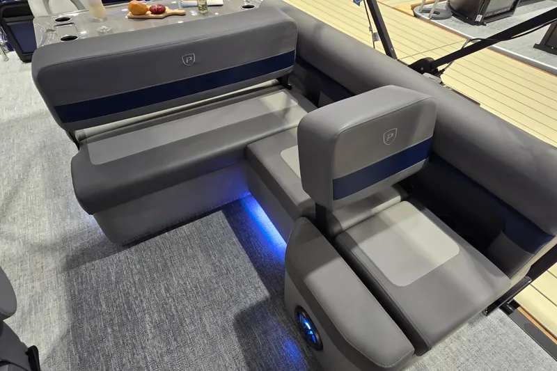 Slide: The Image of Luxurious seating on 2025 Premier 250 Sunsation RS pontoon boat with ambient lighting. - 29