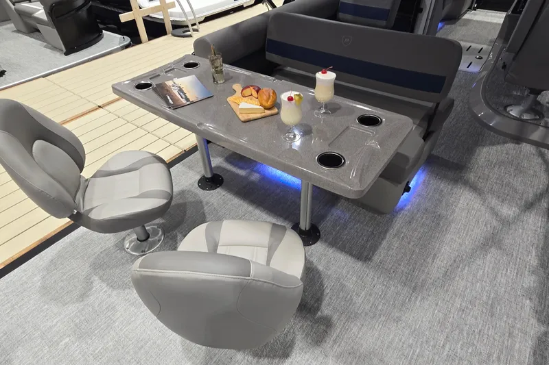 Slide: The Image of Luxurious interior of 2025 Premier 250 Sunsation RS pontoon with seating and refreshments. - 34
