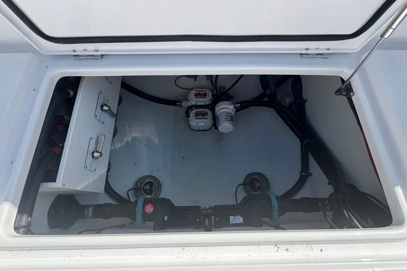 Slide: The Image of Open compartment of 2026 Jupiter 34 boat showing internal wiring and components. - 15