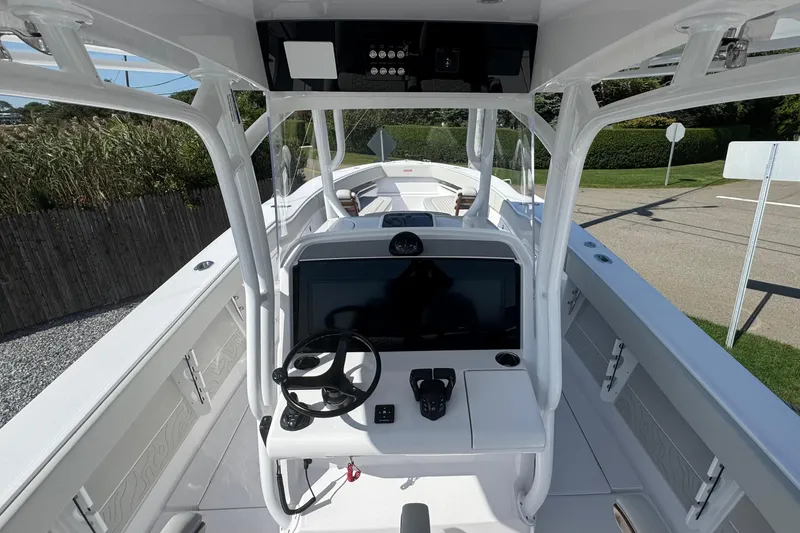 Slide: The Image of 2026 Jupiter 34 boat interior with modern helm and navigation system. - 27