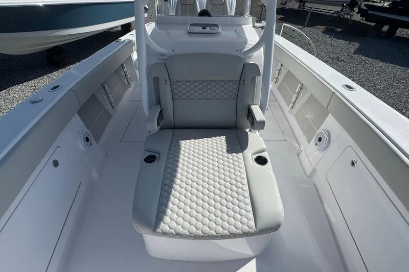 Slide: The Image of 2026 Jupiter 34 boat interior with cushioned seating and sleek design. - 37