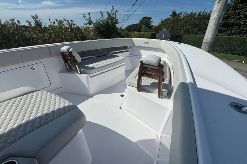 Slide: The Image of 2026 Jupiter 34 boat interior with cushioned seating and sleek design. - 40
