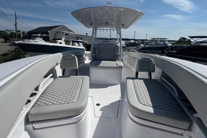 Slide: The Image of 2026 Jupiter 34 boat interior with cushioned seating and sleek design. - 41