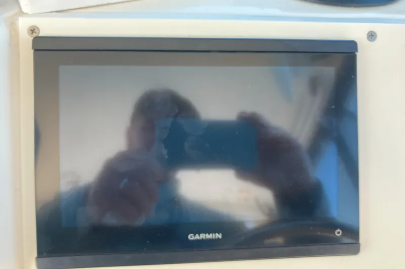 Slide: The Image of Garmin display on 2001 Parker 2520 Sport Cabin boat dashboard. - 19