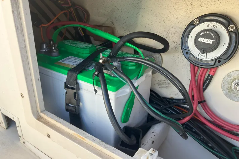 Slide: The Image of Battery compartment of 2001 Parker 2520 Sport Cabin boat with wiring and switch. - 32