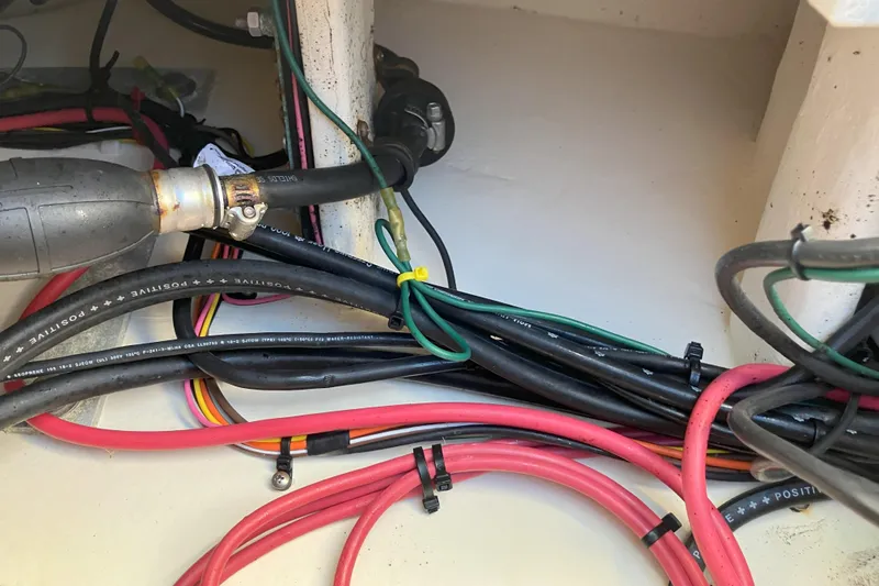 Slide: The Image of Wiring and hoses inside a 2001 Parker 2520 Sport Cabin boat. - 33