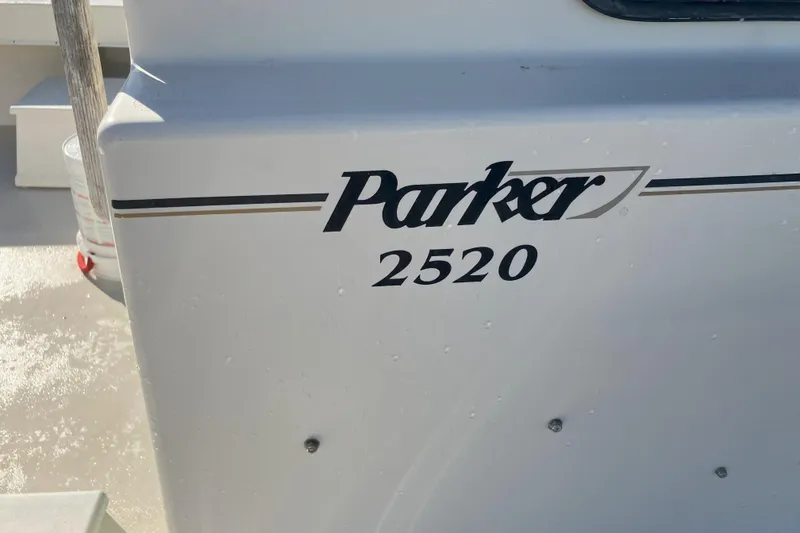 Slide: The Image of 2001 Parker 2520 Sport Cabin boat model name on hull. - 34