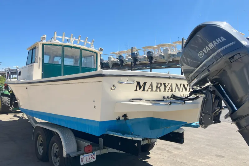 Slide: The Image of 2001 Parker 2520 Sport Cabin boat on trailer with Yamaha outboard motor. - 35