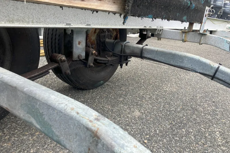 Slide: The Image of Trailer axle and wheel assembly for 2001 Parker 2520 Sport Cabin boat. - 41